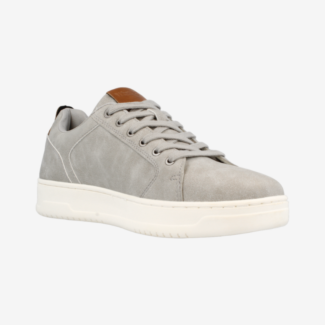 Gray sneaker with white sole on a light gray background