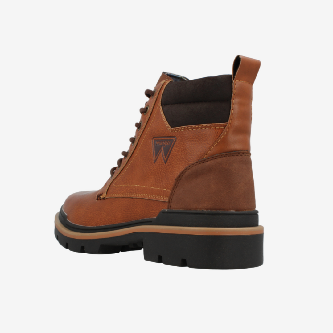 Brown boot with black sole on a white background
