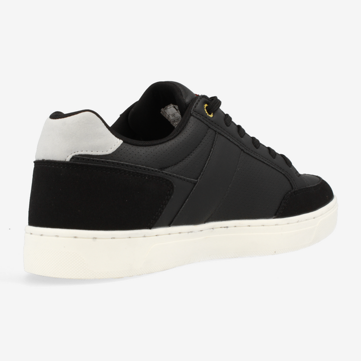 Black sneaker with white sole on a light gray background