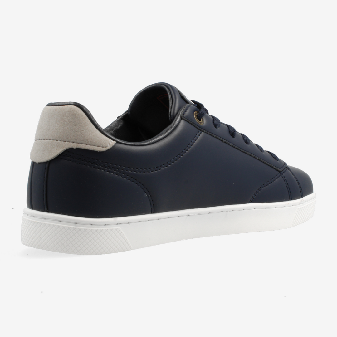 Navy blue sneaker with white sole on a light gray background