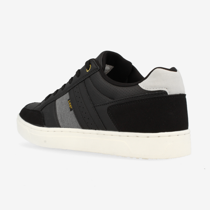 Black sneaker with white sole on a light gray background